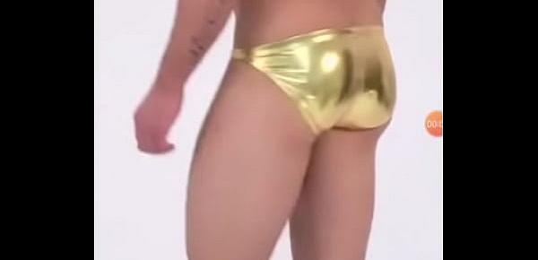  Guy in metallic golden bikini